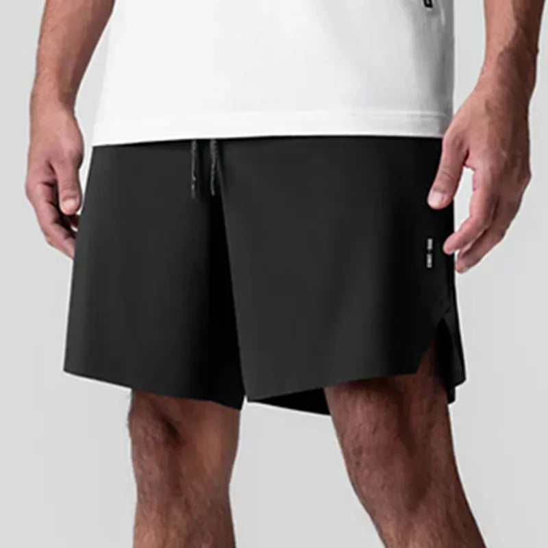 Men's grey seamless sports shorts with a straight-leg, knee-length cut on a mannequin.