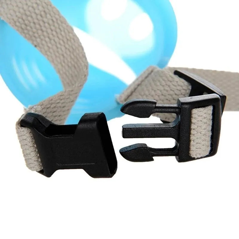 Blue and green silicone anti-bite mouth covers for dogs in two sizes on a white background.