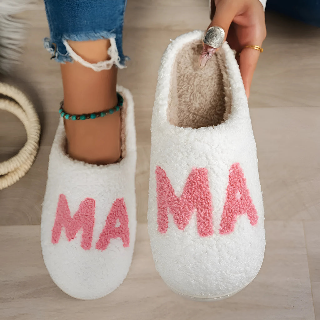 White plush cotton slippers with non-slip TPR sole on indoor floor