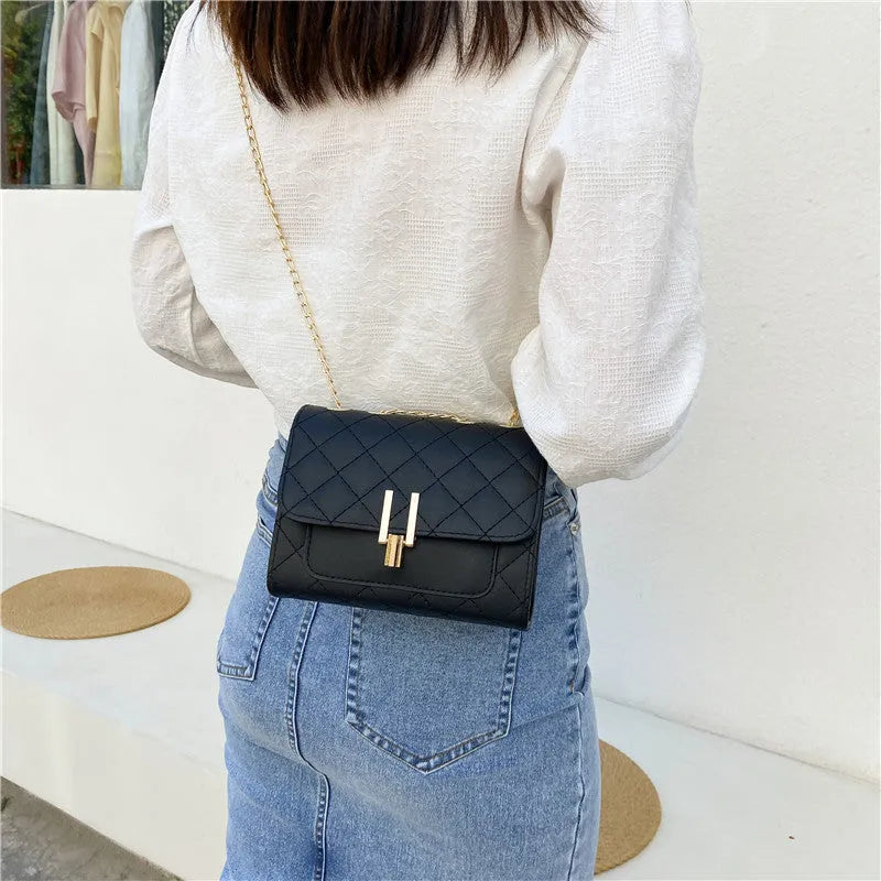 Women's crossbody bag with diamond lattice chain design in PU leather showing black colour option