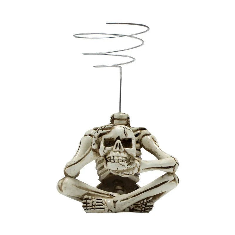 Skull-shaped resin Tillandsia bracket with iron insert for soilless air plant display in gothic style