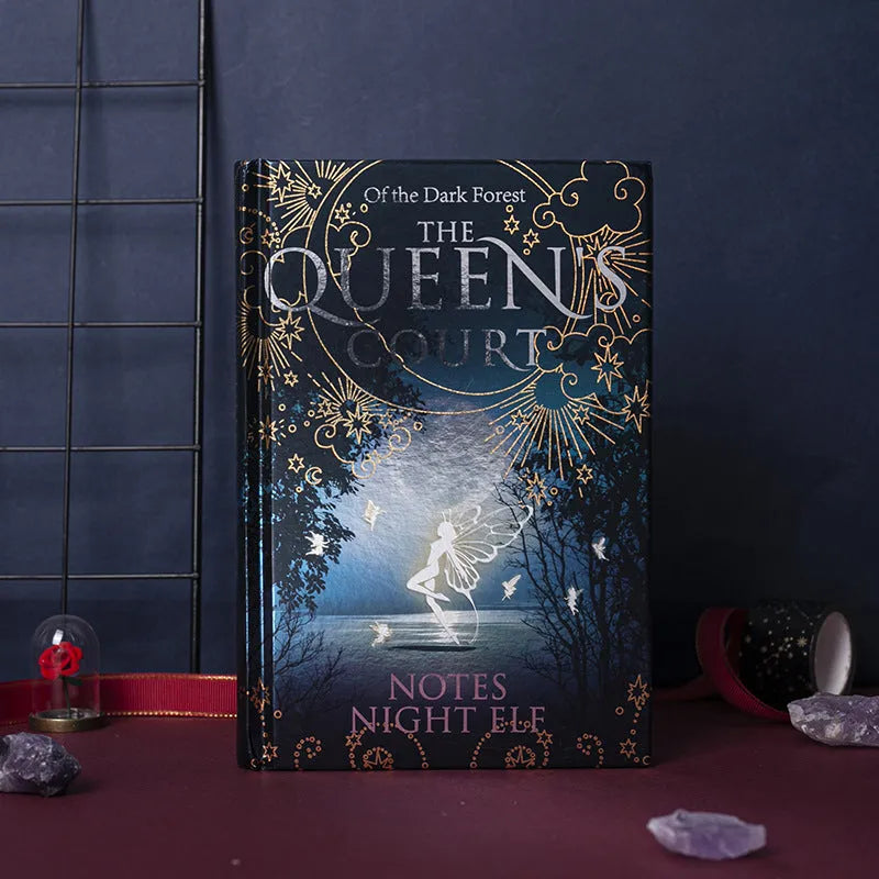 Blue A5 luminous hardcover notebook open to show full-colour illustrated interior pages.