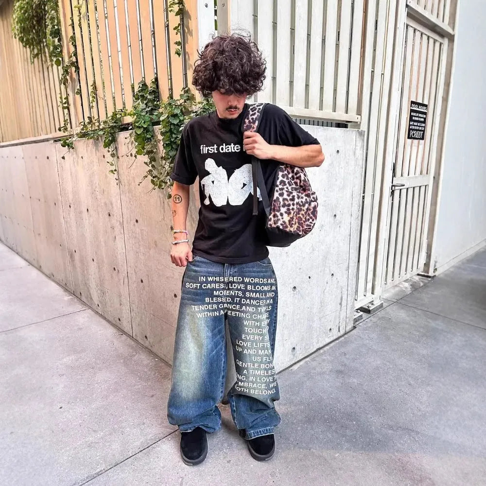 Man wearing loose fit black wide leg cotton casual trousers