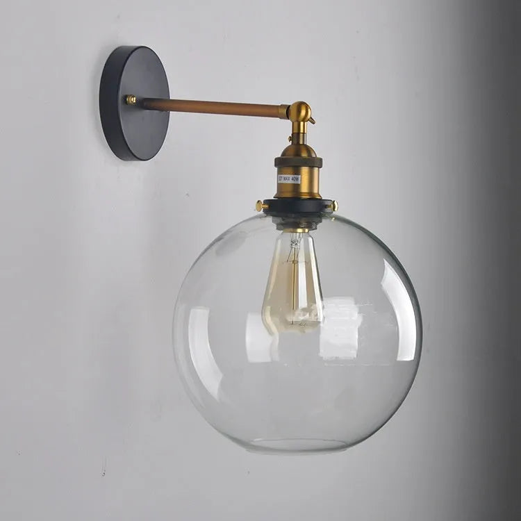 20cm round glass ball wall lamp with aluminium holder in amber, smoke grey, or transparent.