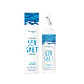 100ml bottle of sea salt styling hair spray with kelp extract on a plain background.