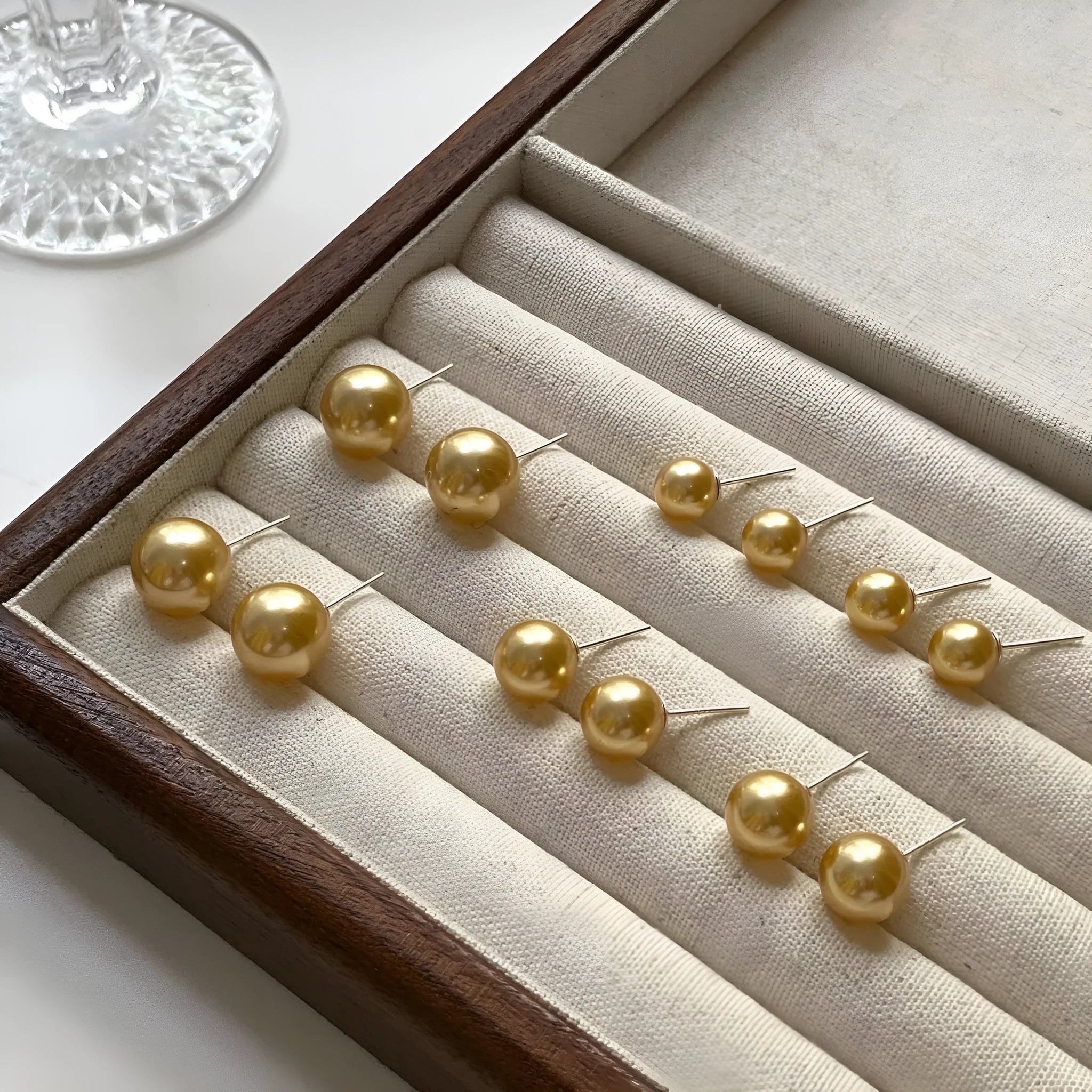 Women's geometric pearl stud earrings with silver settings and retro styling