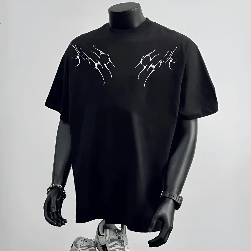 A man wearing a loose-fit black pure cotton short sleeve t-shirt, suitable for business casual settings.