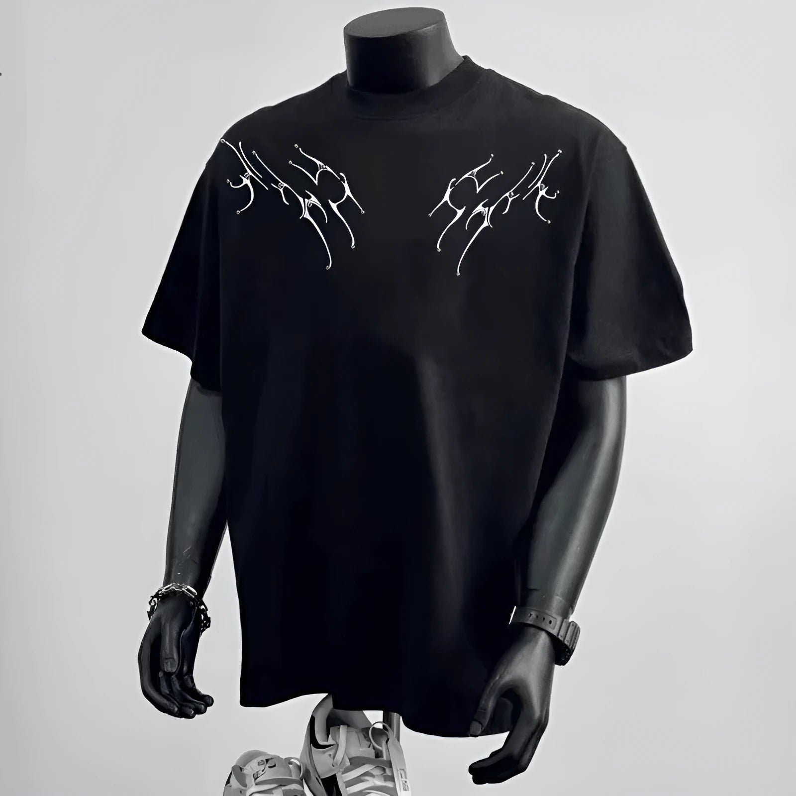A man wearing a loose-fit black pure cotton short sleeve t-shirt, suitable for business casual settings.