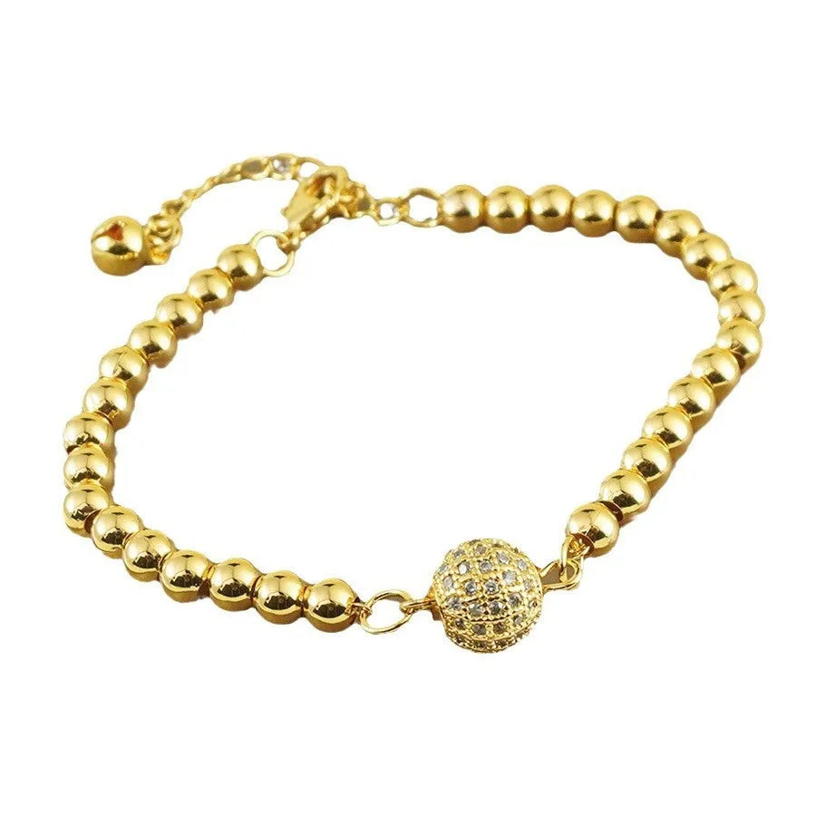 Heart-shaped copper bracelet with round zircon stones in an Arabic style.