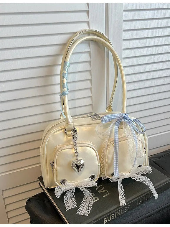 Beige PU shoulder bag with mobile phone pocket and double connector straps on horizontal square suitcase shape