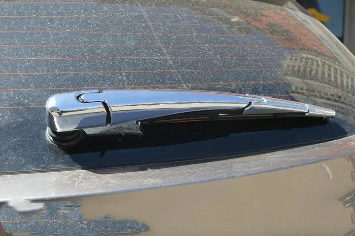 Four silvery ABS plastic rear window wiper cover trims for a 2010 Hyundai.
