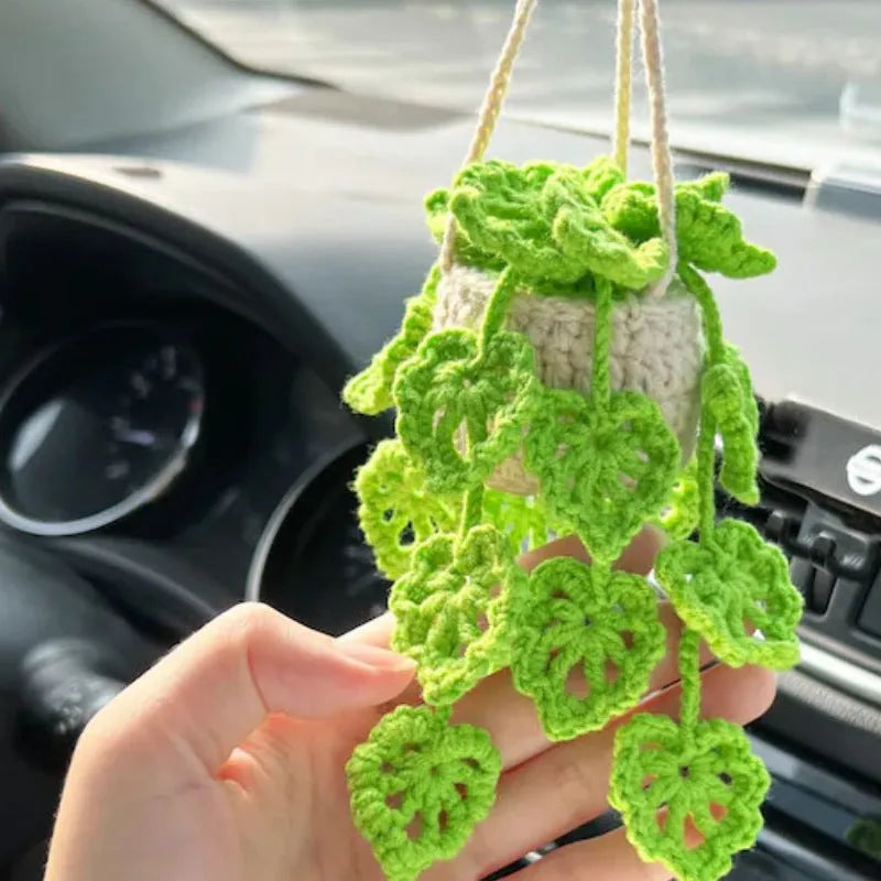 Green and white knitted wool plant ornament for car dashboard with hanging cord