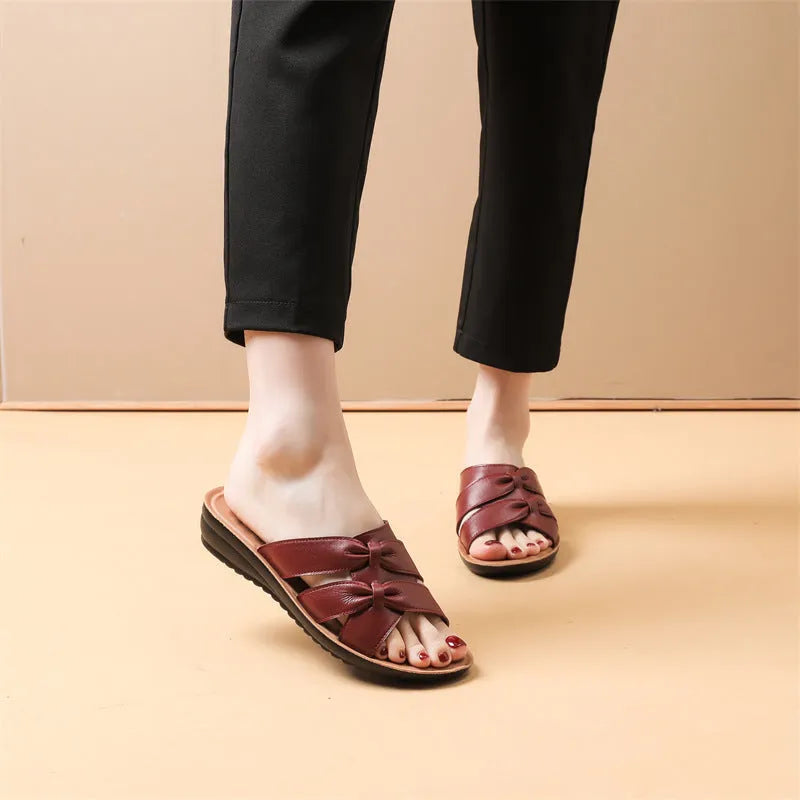 Women's cowhide slippers in beige, black, or red colours with non-slip soles and imitation leather lining