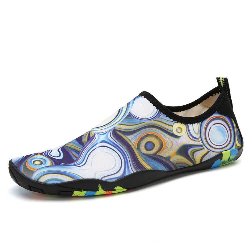 Lycra beach wading shoes with EVA midsole in blue, shown on a sandy shore.