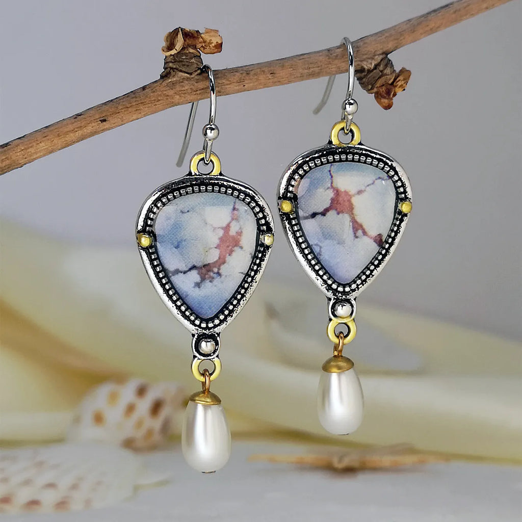 Retro blue drop earrings with electroplated metal, synthetic blue opal, and white pearl components