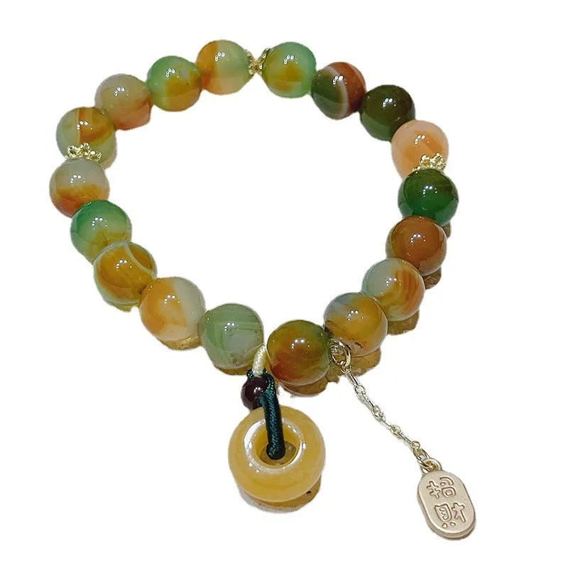 Yellow peacock agate women's bracelet with peace buckle closure measuring 1cm wide