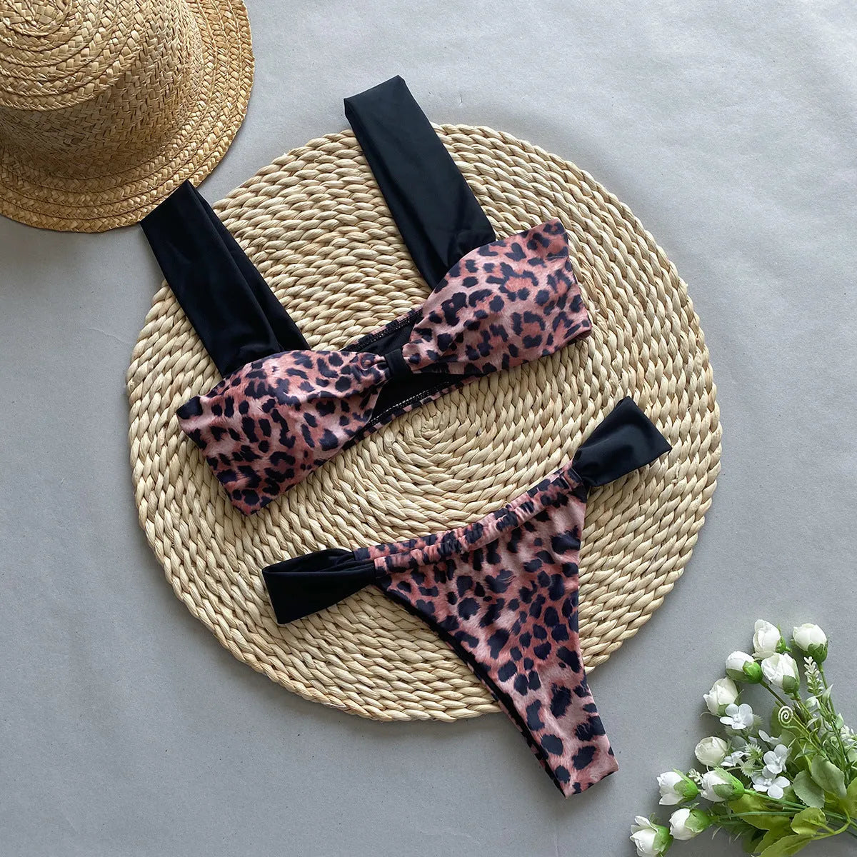 Women's leopard print bikini set with tube top and split bottoms in black and animal print