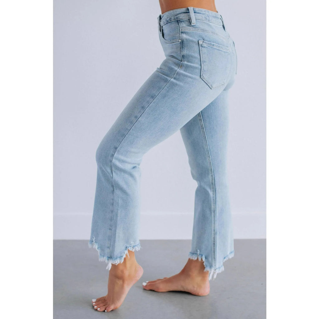 Solid colour women's cotton denim jeans with a hand-worn finish in light blue and dark blue.