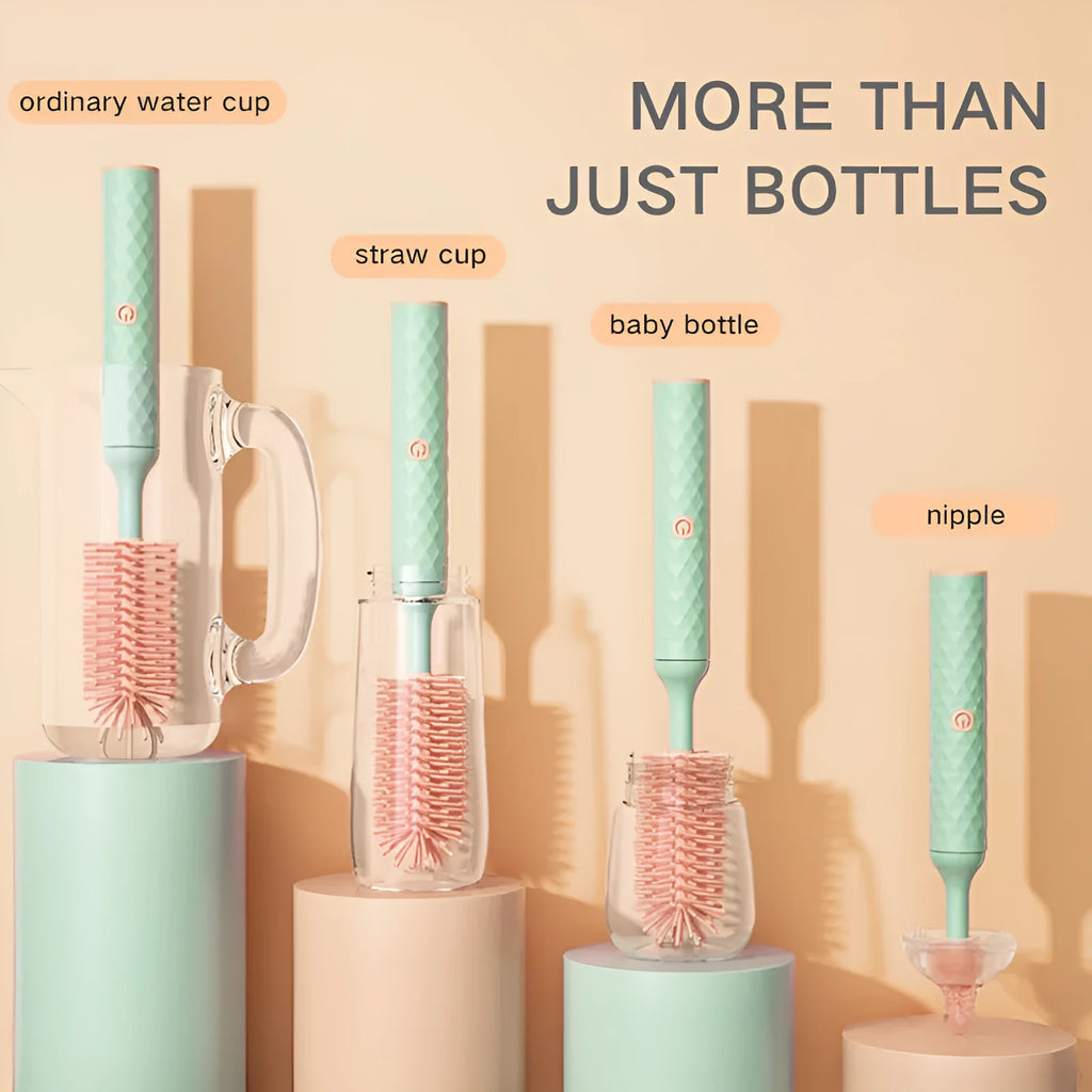 Pink and green electric rotating silicone bottle brush set for cleaning baby bottles and cups.