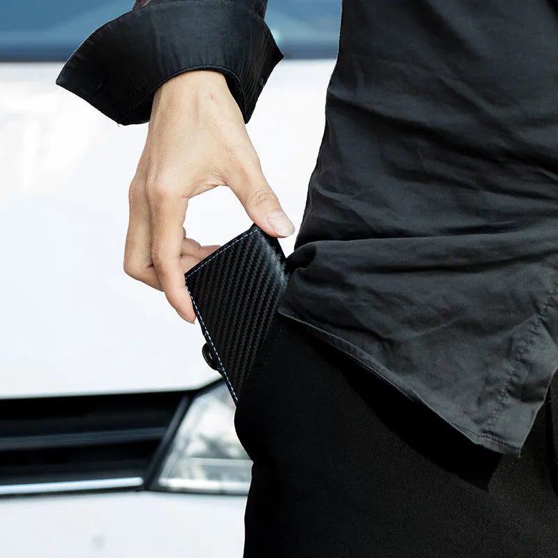 RFID anti-scanning zipper card holder in carbon fibre with plaid pattern and leather trim, showing multiple compartments