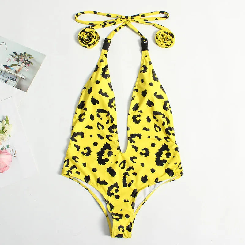 Women's leopard print one-piece swimsuit with bandage style buckle detailing and backless design