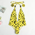 Women's leopard print one-piece swimsuit with bandage style buckle detailing and backless design