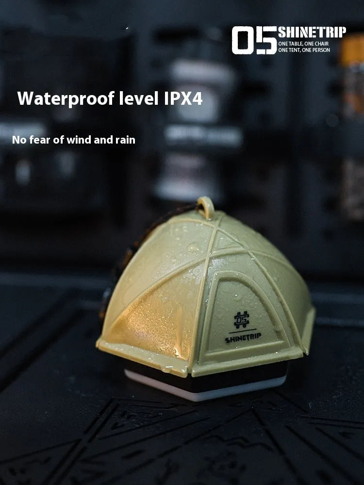 Camping tent light with analog brightness dial in dark green colour, showing compact dimensions