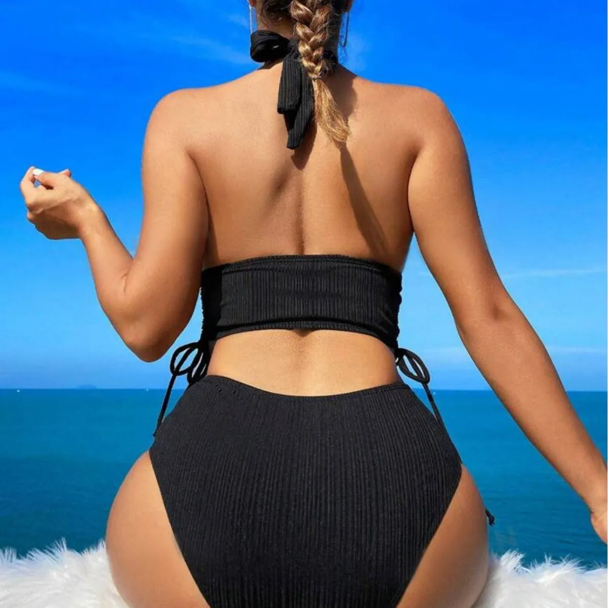 Black lace-up halter bikini set with matching briefs on mannequin
