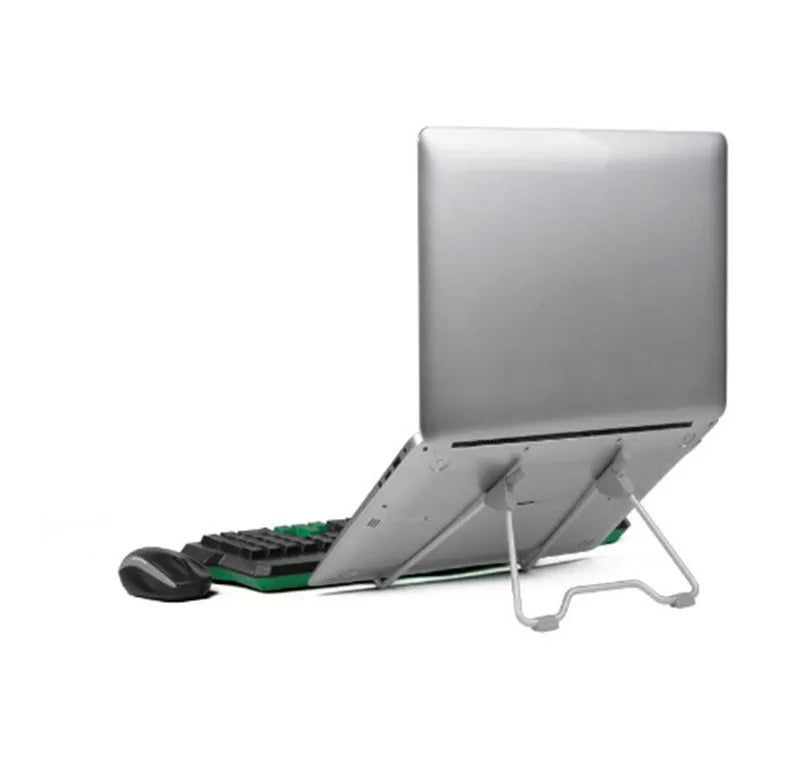Grey foldable aluminium and plastic stand holding a mobile phone and a laptop on a desk.