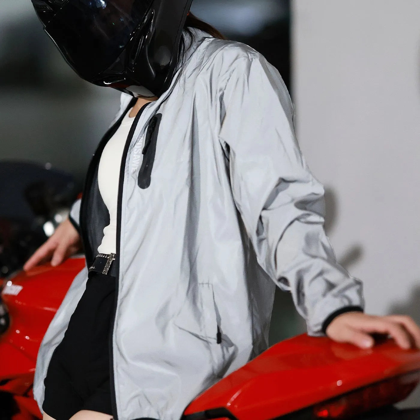 Silver men's waterproof polyester long-sleeved coat on a hanger.