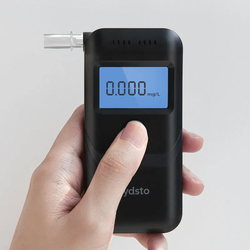 Black handheld household alcohol breath tester model HD-JJCSY01 on a white background.