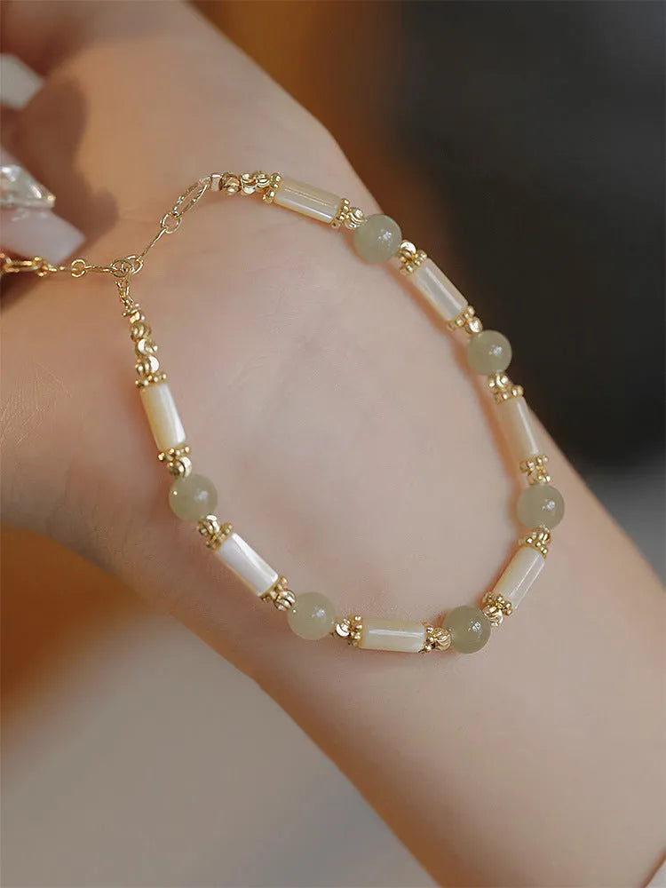 Women's Hetian jade bamboo joint bracelet in 6mm size, shown in jade and South red colours.