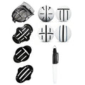 Plastic golf scriber putter alignment tool set with scribers and drawing pens on a green.