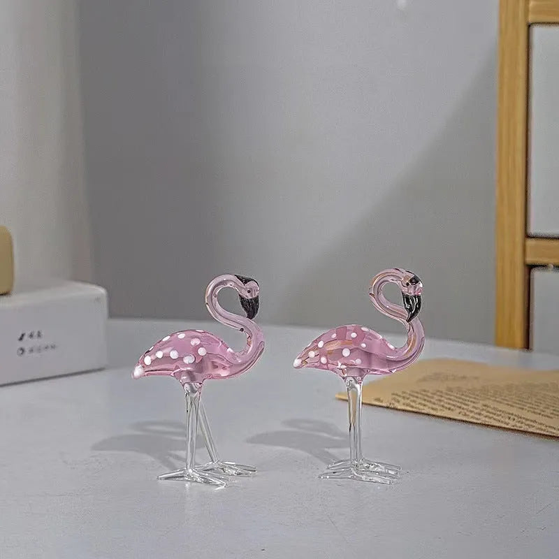Pink crystal simulation flamingo decorative ornament on a table for home decor or gifting.