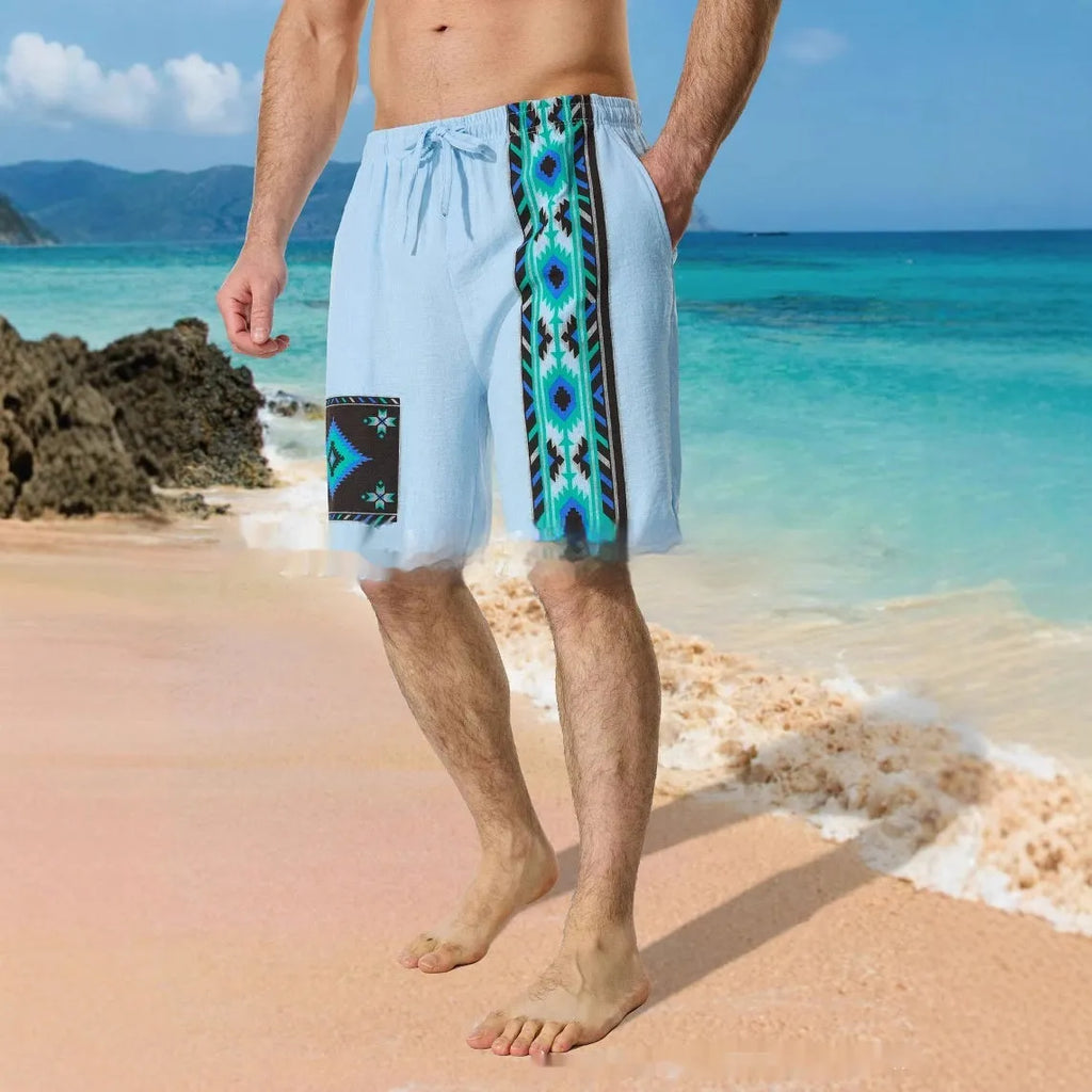 Man wearing blue colour block print loose casual shorts with lace-up waist.