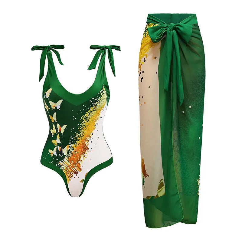 Solid colour women's one-piece swimsuit with thin spaghetti straps and a separate matching swim skirt.