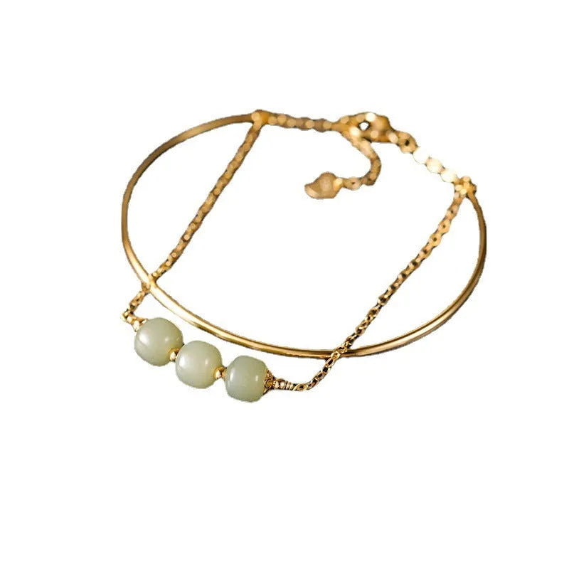 Women's jade lucky beads bracelet with gold inlay, shown in single, double, and three bead versions.