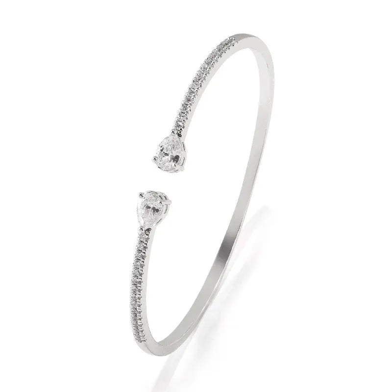 Multi-zircon bracelet with inlaid design on copper material in white or blue colour
