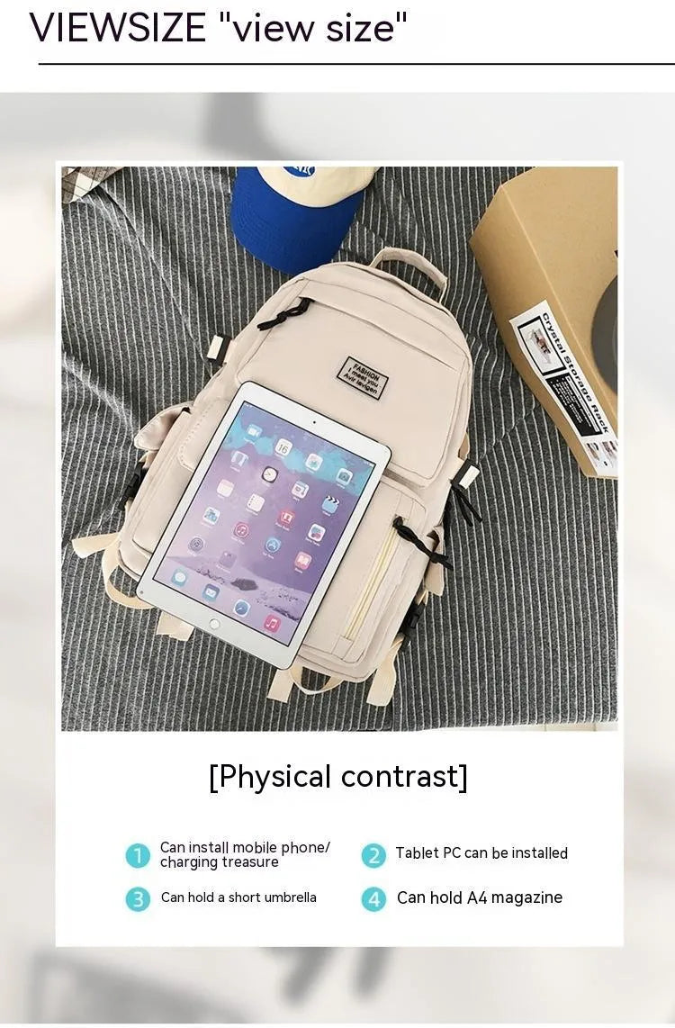 Black and white nylon student backpack with laptop compartment and 3D pockets.