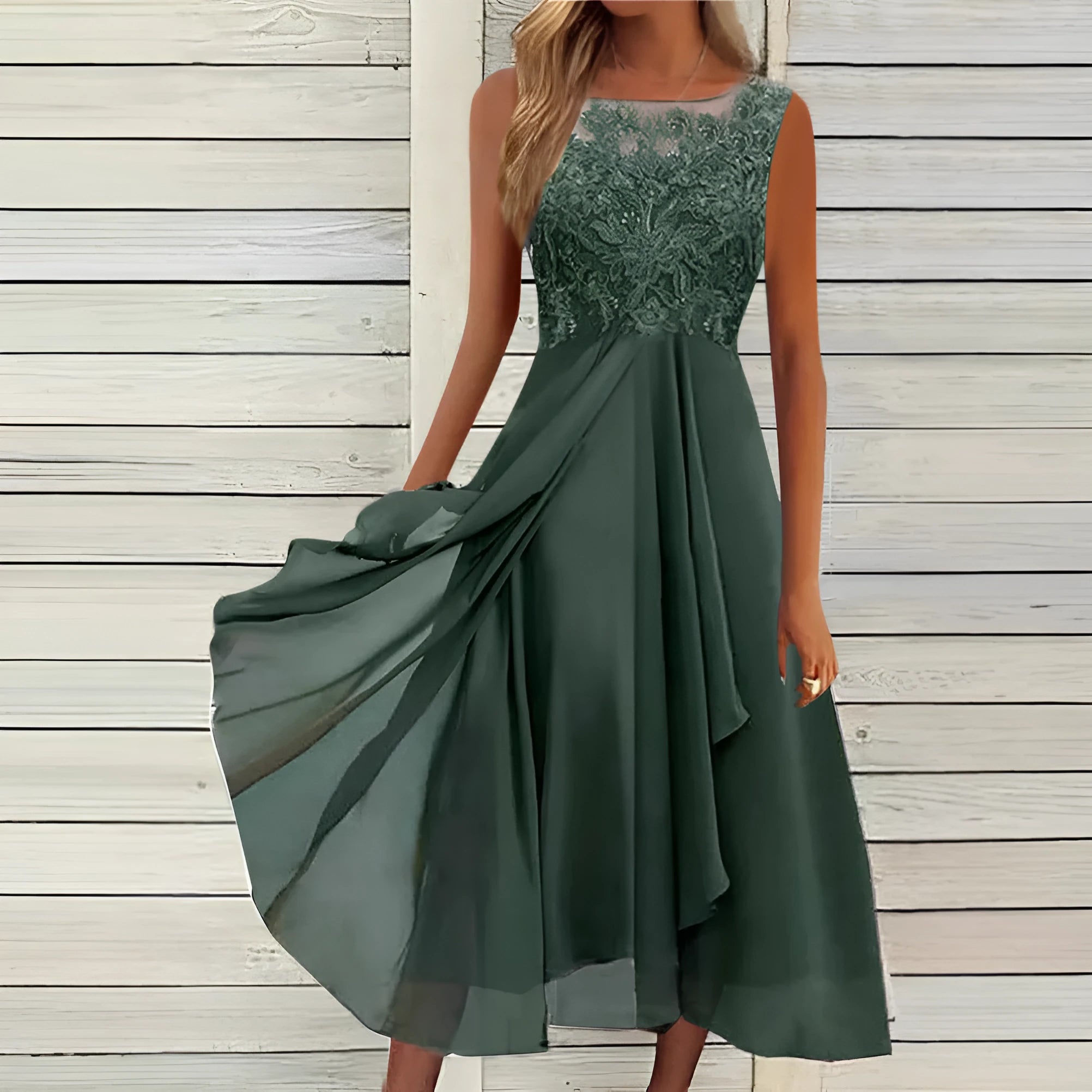 Women's sleeveless green chiffon dress with lace hollow-out detail on a mid-length skirt.