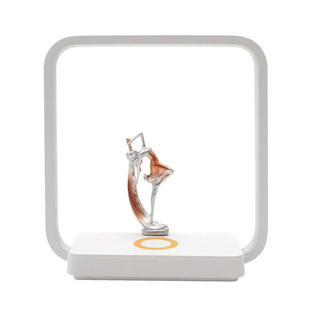 Blue decorative table lamp with wireless phone charging pad integrated into base