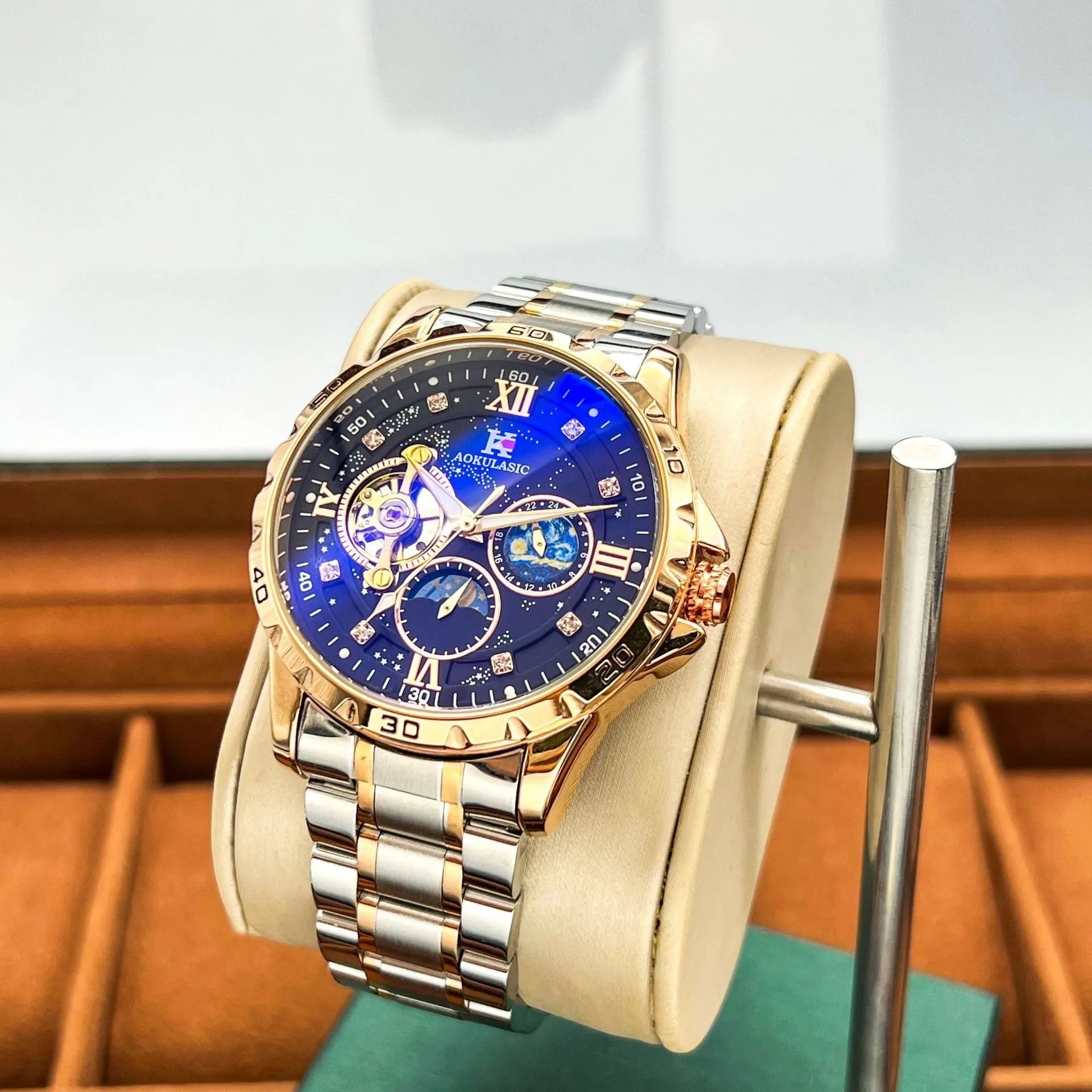 Rose gold automatic men's watch with large black dial and stainless steel case