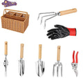 Gardening tools set with wooden handles and stainless steel hoe and shovel on rustic background