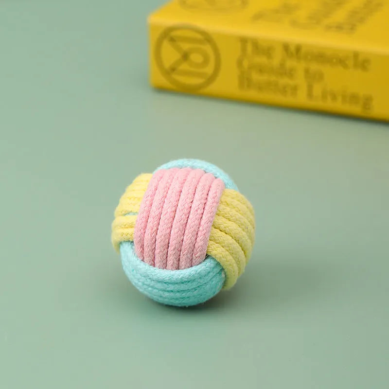 Handmade small blue powder and green plush cotton ball cat toy for teeth grinding.
