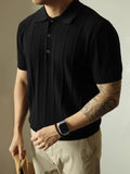 Men's loose fit solid colour polyester T-shirt on a hanger, shown in black and white colour options.