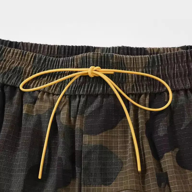 Men's green washed camouflage cotton shorts with a loose fit and mid waist design