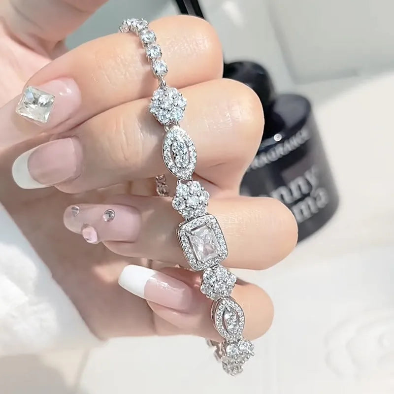 Geometric women's silver bracelet with zircon stones, shown in two length options.