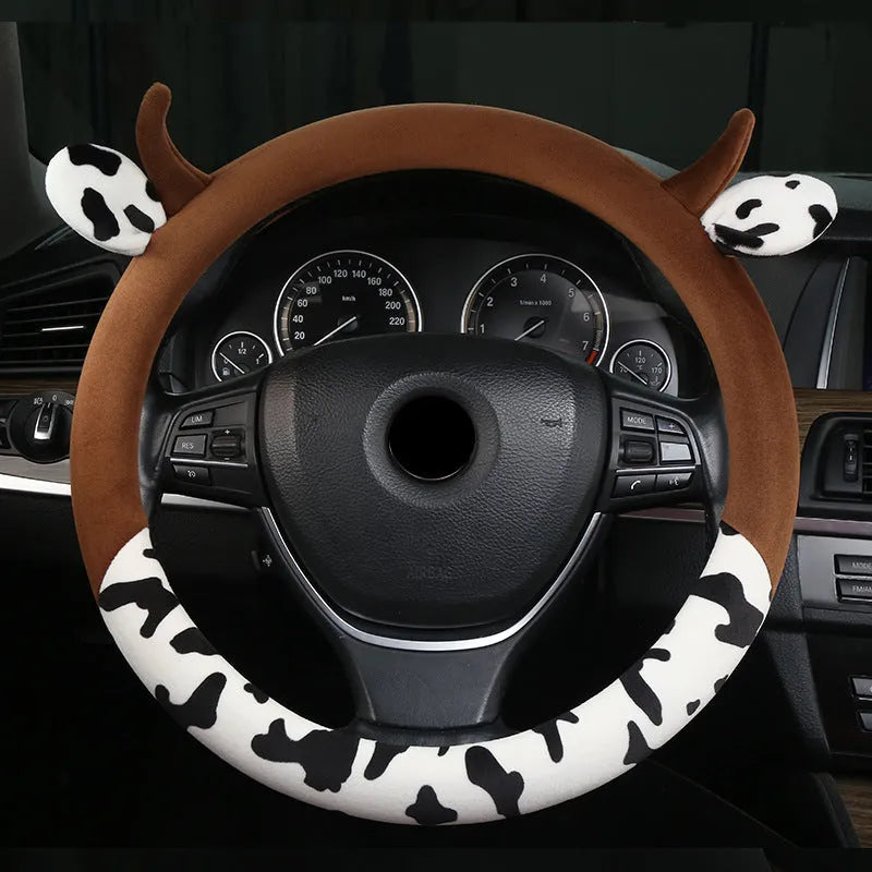 Black short plush automotive steering wheel cover showing protective handle feature