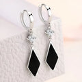 Silver geometric diamond-shaped clip earrings with vintage finish