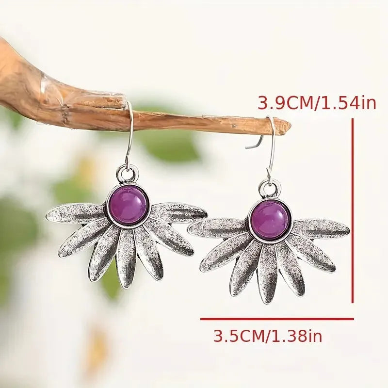 Purple bohemian earrings with resin gemstone details and animal or zodiac modelling